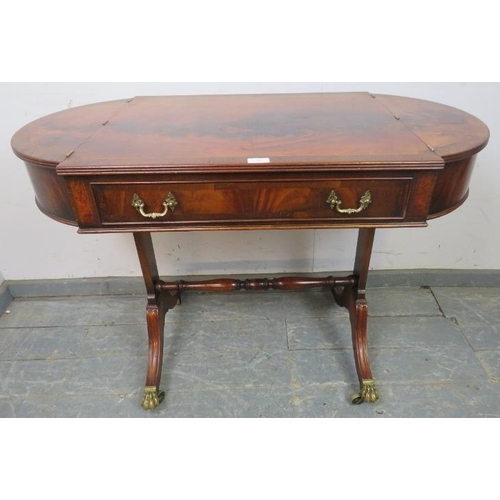 841 - A Regency Period style feathered mahogany side table, 20th century, the cross-banded rectangular top... 