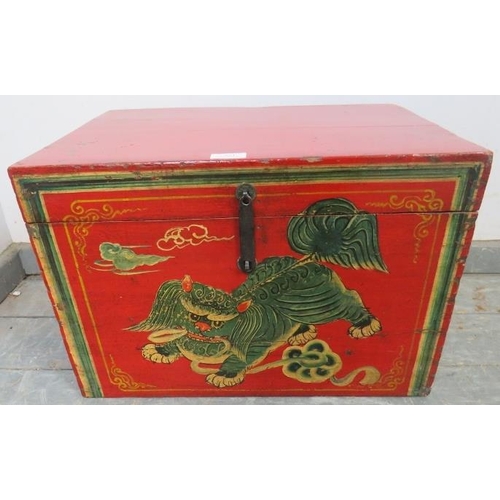 851 - An Eastern chinoiserie decorated red lacquered storage box, 20th century, 52cm wide x 35cm high x 37... 