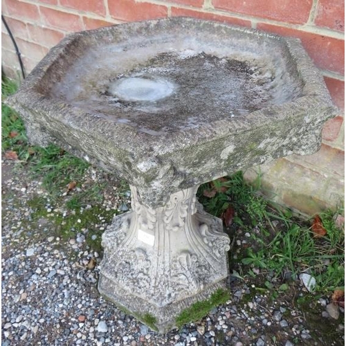 856 - A nicely weathered reconstituted stone bird bath on pedestal base, 20th century.
H52cm Diameter 51cm... 