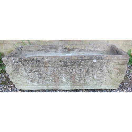 858 - A nicely weathered reconstituted stone plant trough, relief moulded with classical motifs.
W72cm H25... 