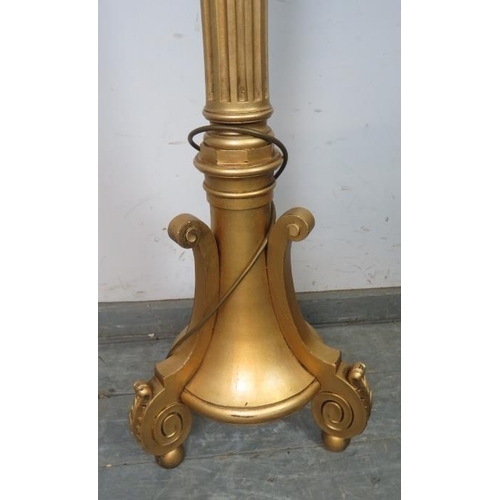 877 - An Edwardian giltwood standard lamp in the Neo-Classical taste, the reeded column on a weighted plin... 