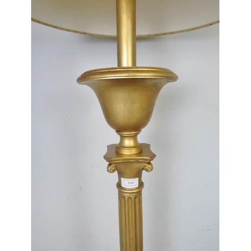 877 - An Edwardian giltwood standard lamp in the Neo-Classical taste, the reeded column on a weighted plin... 