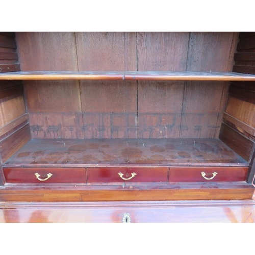 887 - A Georgian mahogany bureau bookcase, the top section with two height-adjustable shelves above three ... 