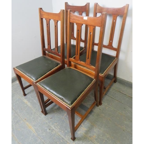 888 - Four Arts & Crafts mahogany dining chairs by Maple & Co, having pierced backrests and seats upholste... 