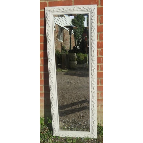 889 - A contemporary bevelled dressing mirror, in an acanthus moulded frame painted white. 
H131cm W46cm (... 