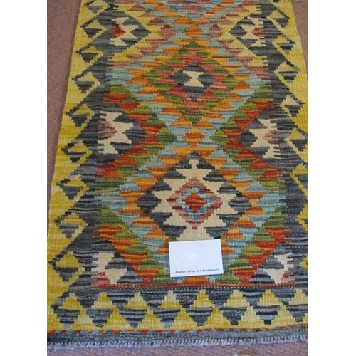 916 - A Chobi Kilim runner, six interlocking diamond motif on a lemon ground. Good condition. 200cm x 57cm... 