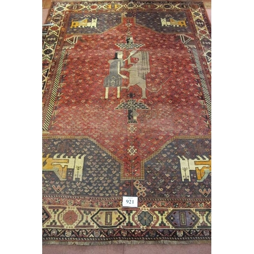 921 - South West Persian Qashqai carpet. Central motif of a standing figure with a lion and four corner sp... 