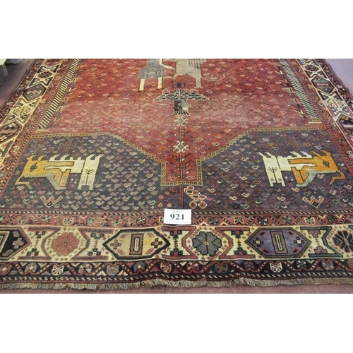 921 - South West Persian Qashqai carpet. Central motif of a standing figure with a lion and four corner sp... 