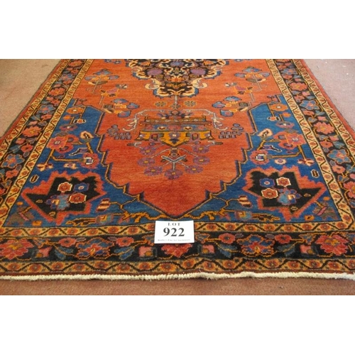 922 - A North West Persian Malayer rug, central Medallion on salmon ground. 240cm x 135cm.
Condition repor... 