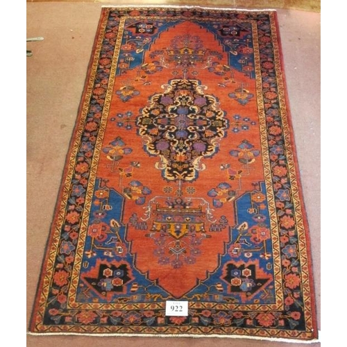 922 - A North West Persian Malayer rug, central Medallion on salmon ground. 240cm x 135cm.
Condition repor... 