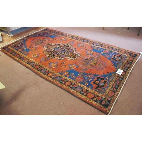 922 - A North West Persian Malayer rug, central Medallion on salmon ground. 240cm x 135cm.
Condition repor... 