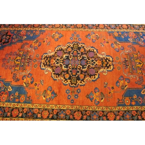 922 - A North West Persian Malayer rug, central Medallion on salmon ground. 240cm x 135cm.
Condition repor... 