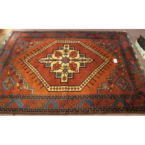 923 - A Fine 20th Century Turkish Afghan Kunduz carpet.  Central Medallion on red/burnt amber ground flank... 