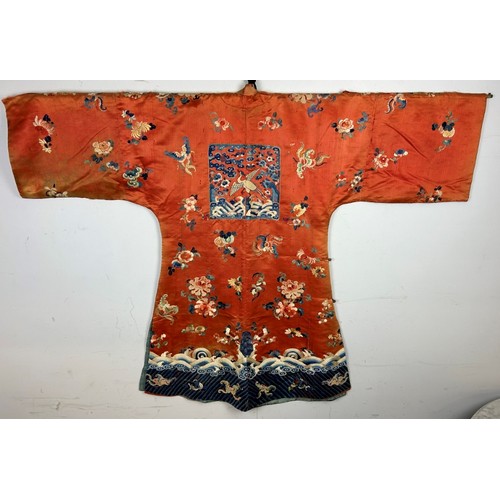 91 - A Chinese kesi and Peking knot silk embroidered red robe, probably late 18th/early 19th century. Emb... 