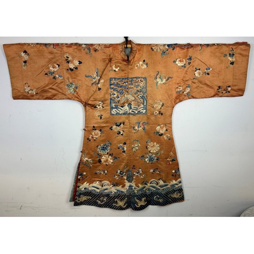 91 - A Chinese kesi and Peking knot silk embroidered red robe, probably late 18th/early 19th century. Emb... 