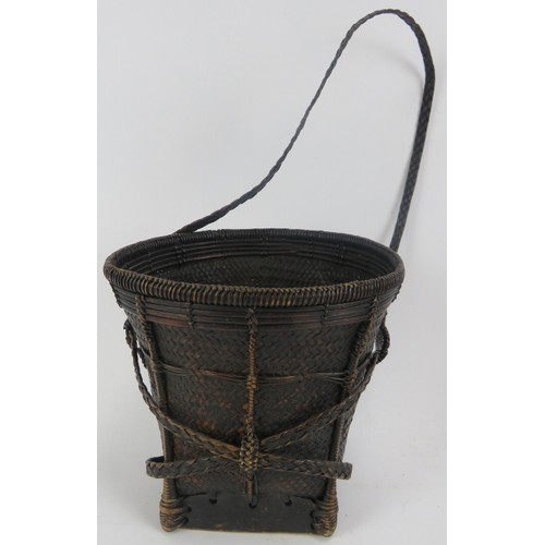 93 - A group of six Indonesian woven rattan baskets and containers. (6 items) 36 cm tallest height. 
Cond... 