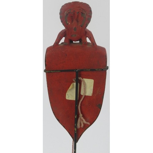 95 - A Southeast Asian red lacquered and carved wood plumb line. Modelled with surmounted bird and cord s... 