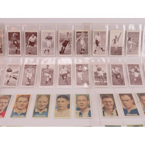 166 - A collection of vintage British famous footballers cigarette cards, circa 1930s. Cards issued by Joh... 