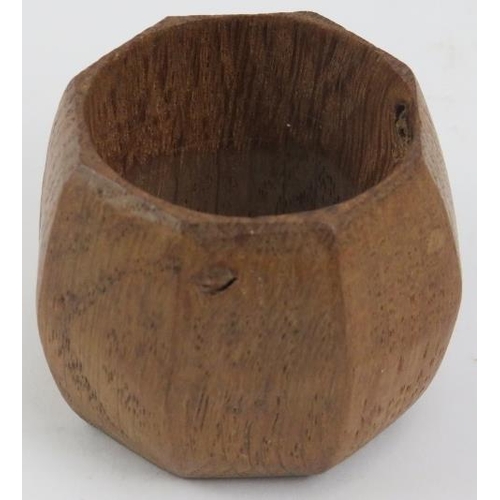 104 - A Robert Thompson of Kilburn 'Mouseman' octagonal oak napkin ring with mouse carved in relief. 3.7 c... 