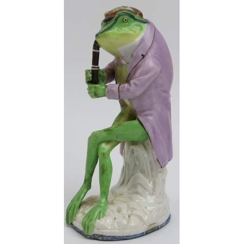 106 - An English hand painted porcelain frog / toad playing a woodwind instrument, mid/late 19th century. ... 