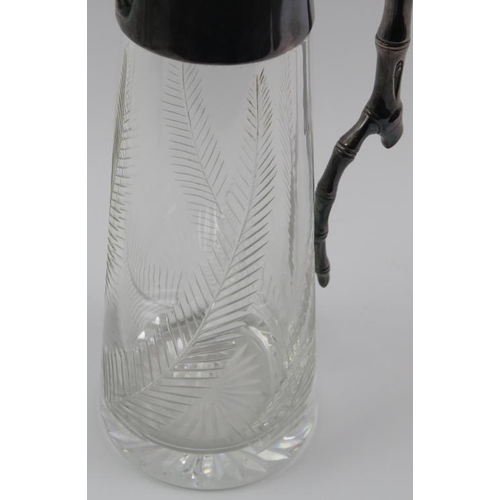 118 - An electroplated silver mounted and cut glass decanter, late 19th/early 20th century. Modelled with ... 