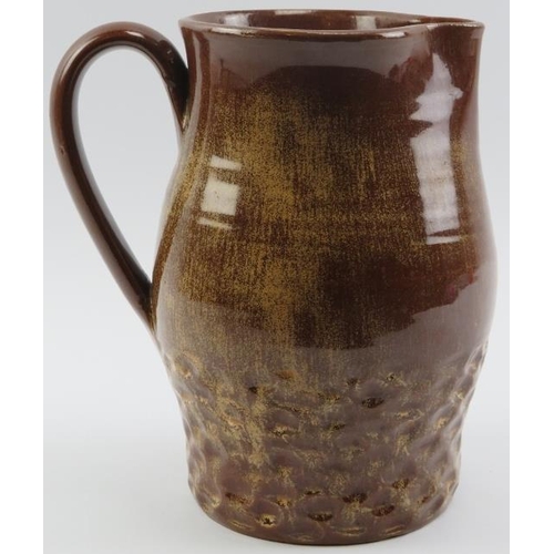 119 - A Susie Cooper brown glazed studio pottery jug, mid 20th century. Incised ’Susie Cooper England’ wit... 