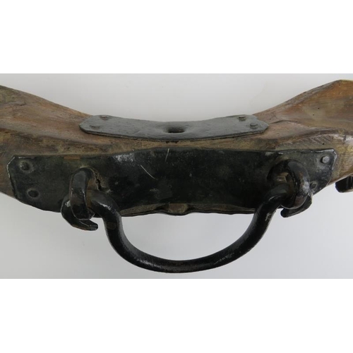 120 - A carved wood and cast iron yoke, early 19th century. 114 cm length. 
Condition report: Some wear wi... 