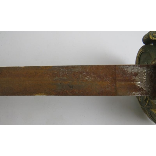 127 - Militaria: A British Naval military sword, 19th century. With wire bound shagreen grip, gilt metal g... 