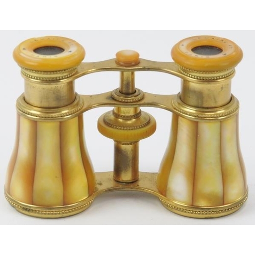 13 - A French pair of Lemaire Fabt of Paris gilt brass and yellow stained mother of pearl opera glasses, ... 