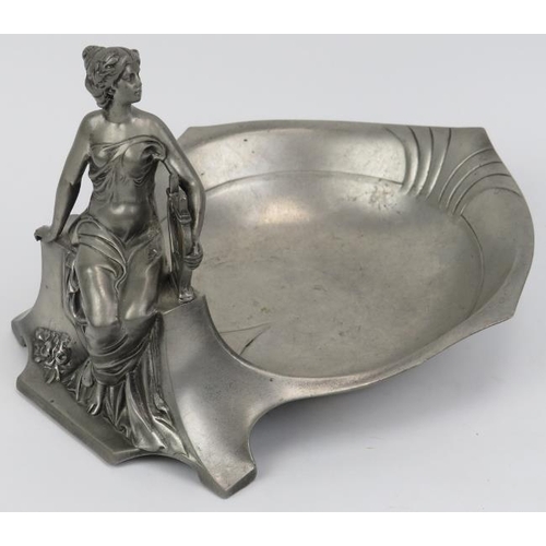 133 - An Art Nouveau pewter figural bowl, early 20th century. Struck with an angel symbol beside letters A... 