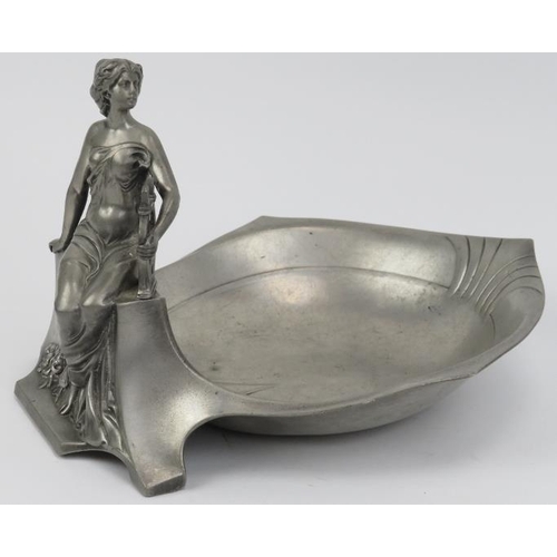 133 - An Art Nouveau pewter figural bowl, early 20th century. Struck with an angel symbol beside letters A... 