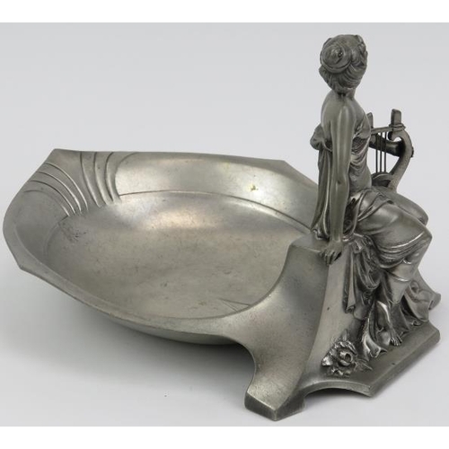 133 - An Art Nouveau pewter figural bowl, early 20th century. Struck with an angel symbol beside letters A... 