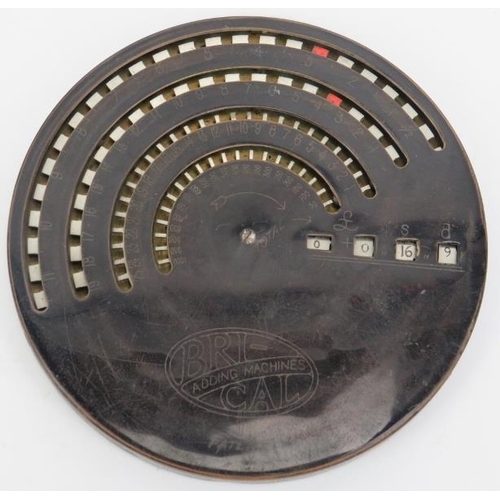 135 - A Bric-Cal adding machine, early 20th century. Of circular forum with a turned bone point adjuster a... 