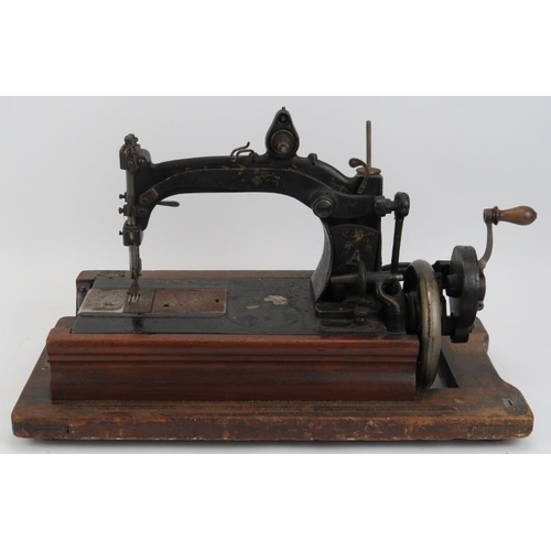 136 - A Victorian lever arm sewing machine, mid 19th century. Manufactured to be hired out to home workers... 