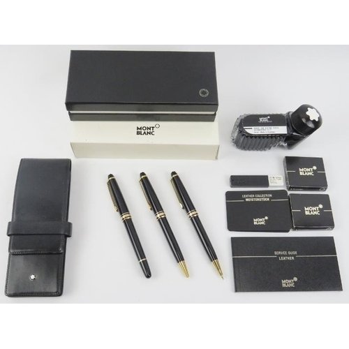 14 - A Montblanc Meisterstück gilt and black matching fountain pen, ballpoint pen and propelling pencil. ... 