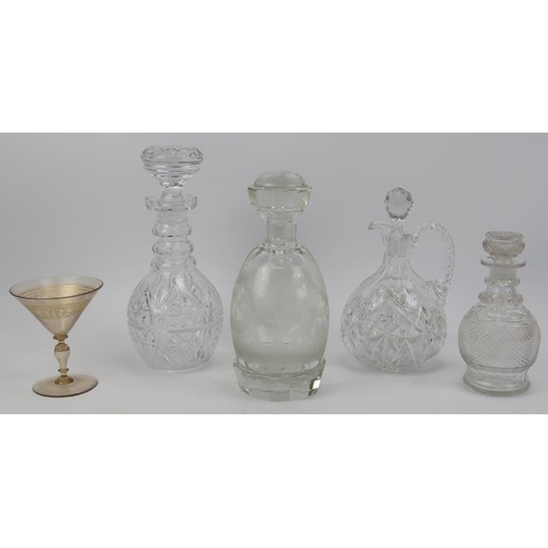 146 - Four clear glass decanters and a cocktail glass. Comprising three cut glass decanters, a decanter en... 