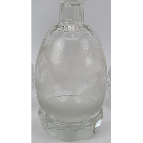 146 - Four clear glass decanters and a cocktail glass. Comprising three cut glass decanters, a decanter en... 