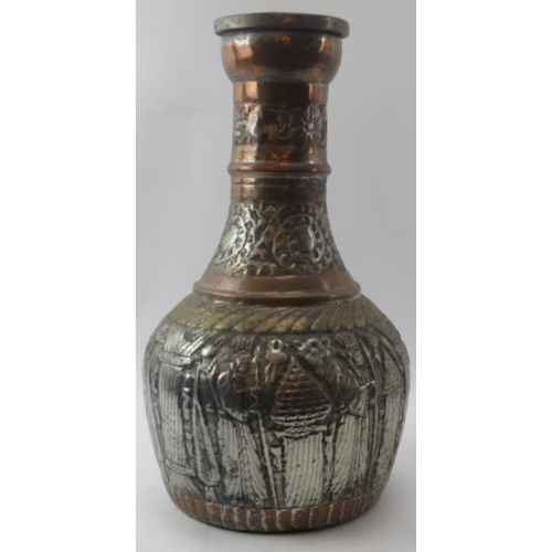 151 - A large Middle Eastern metalwork decanter jug with embossed decoration, 19th century or earlier. Pos... 