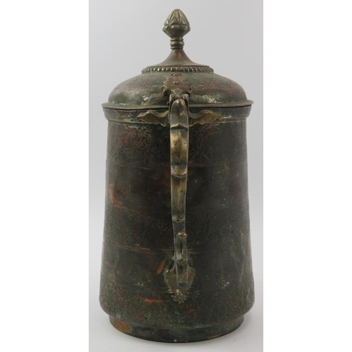 152 - An Indo-Persian metalwork lidded decanter jug with embossed decoration, 19th century. With a hinged ... 