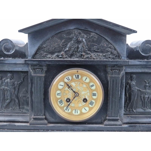 156 - A Victorian black slate and marble mantel clock. The case applied with black painted bronze Neoclass... 