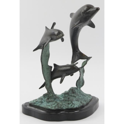 16 - A vintage bronze sculpture depicting dolphins leaping from the water, 20th century. Naturalistically... 