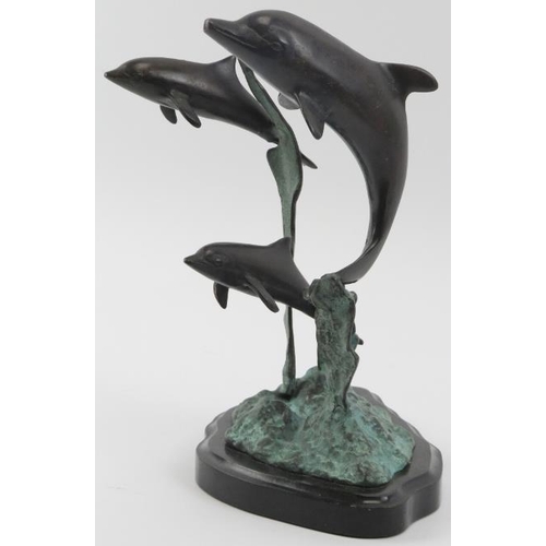 16 - A vintage bronze sculpture depicting dolphins leaping from the water, 20th century. Naturalistically... 