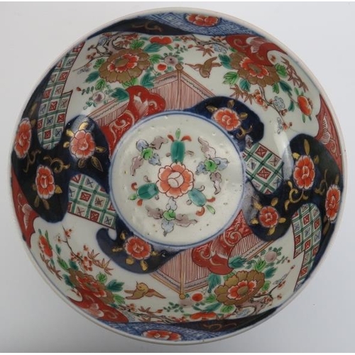 160 - A group of Japanese Imari porcelain wares, late Meiji period. Comprising a bowl on a carved wood sta... 