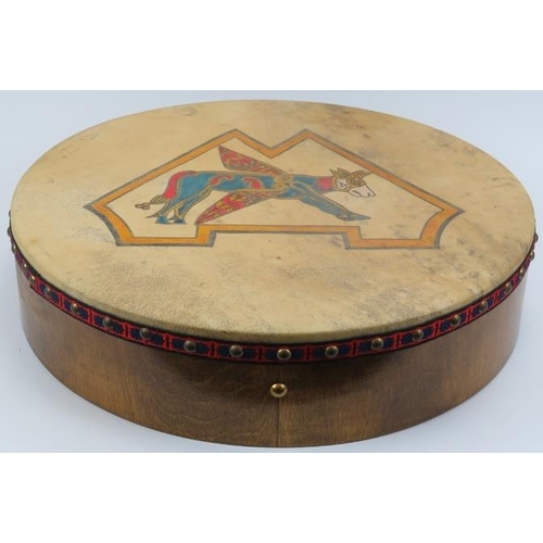 166 - An Irish Bodhrán drum with hand painted winged cow decoration. 46 cm diameter.
Condition report: Som... 