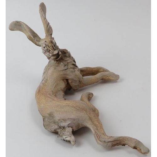 187 - Pierre Diamantopoulo (b.1952) - A studio pottery model of a recumbent hare. Incised signature and da... 