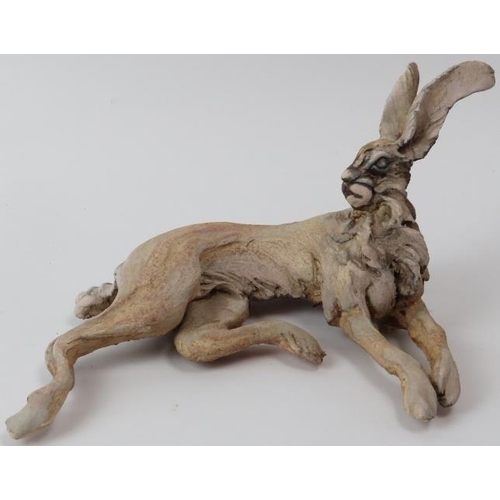 187 - Pierre Diamantopoulo (b.1952) - A studio pottery model of a recumbent hare. Incised signature and da... 