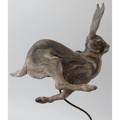 188 - Pierre Diamantopoulo (b.1952) - A studio pottery model of a running hare. Supported on a wire and sa... 