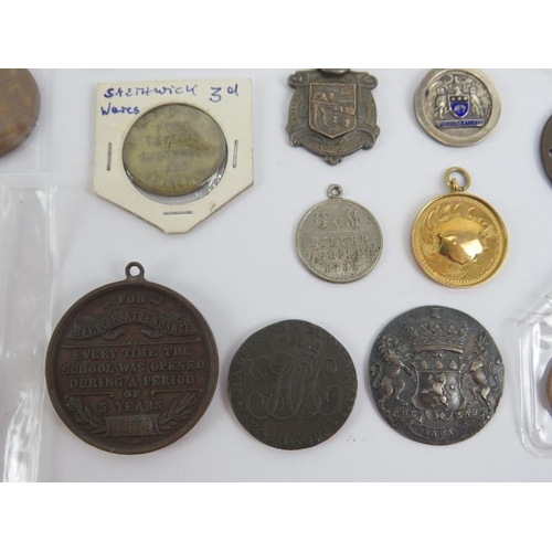 189 - A collection of antique and vintage coin tokens and medallions, 18th century and later. Notable item... 