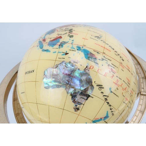 22 - A terrestrial globe inlaid with a variety of stones and abalone shell, late 20th century. The globe ... 