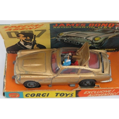 222 - A vintage Corgi 007 Aston Martin DB5, 1965. With original figures, box, inner display stand and docu... 